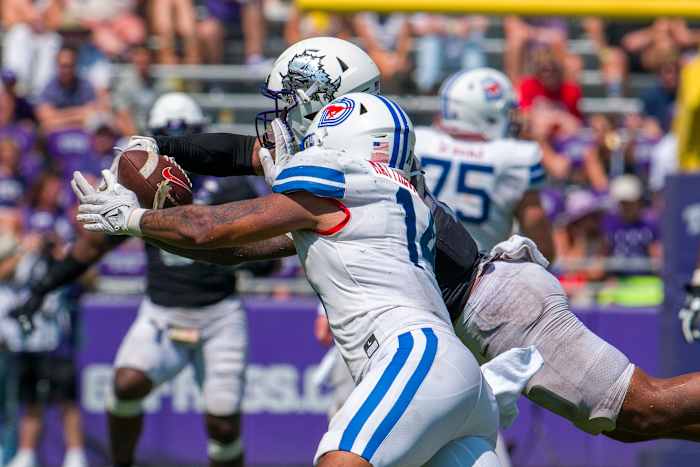 TCU Horned Frogs linebacker Namdi Obiazor (4) breaks up a pass intended for SMU Mustangs tight end Nolan Matthews-Harris (14) during the second half at Amon G. Carter Stadium.